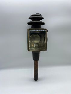 an old fashioned street light on a white background