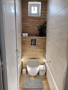 a small bathroom with a toilet and bathtub