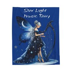 a blue towel with a fairy holding a harp and the words star light music fairy on it