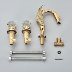 an assortment of brass faucets and screws