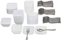 a bunch of forks and spoons sitting next to each other on a white surface