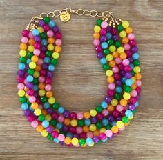 "Somewhere Over The Rainbow🌈 These beads are exquisite! This necklace goes with EVERYTHING! Simply Stunning! Necklace is 18\" long with a 4.5\" gold chain for easy adjusting Click Here for the Matching Earrings! https://www.etsy.com/listing/913142571/crystal-earring-crystal-stud-earring?ref=shop_home_active_2&sca=1&sts=1 Click Here for the Matching Bracelet! https://www.etsy.com/listing/1139788336/sparkling-bracelet-stretch-crystal?ref=shop_home_active_1&pro=1&sts=1 All our neck Rainbow Multi-strand Necklace Gift, Rainbow Multi-strand Necklace As Gift, Rainbow Multi-strand Necklace For Gift, Rainbow Multi-strand Jewelry For Gifts, Lgbtq Jewelry, Colored Pearl Necklace, Rainbow Gifts, Pride Jewelry, Pride Jewellery