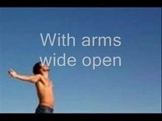 a man with his arms wide open in front of a blue sky and the words, with arms wide open