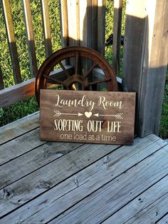 a wooden sign that says love is a four legged word on the side of a porch