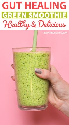 a hand holding a green smoothie in a glass with the text, gutting green smoothie healthy and delicious