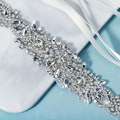 Elegant Bedazzled Silver Bridal Accessories, Elegant Silver Bedazzled Bridal Accessories, Silver Crystal-embellished Bridesmaid Sash, Silver Sashes For Bridal Party Accessories, Silver Bridal Accessories For Party, Silver Bridal Accessories With Sashes For Party, Silver Bridesmaid Sashes Bridal Accessories, Elegant Silver Embellished Wedding Dress, Elegant Rhinestone Bridal Belt For Bridesmaids