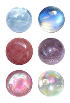 four different colored marbles are shown in this image