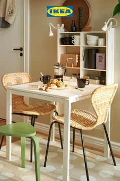 a table with two chairs and some food on it