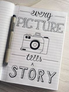 a notebook with the words, every picture tells a story on it and a camera