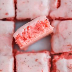 a piece of cake that has been cut in half and is being held up to the camera