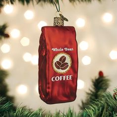 a red bag ornament hanging from a christmas tree