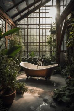 an old fashioned bathtub in a greenhouse with lots of greenery and potted plants