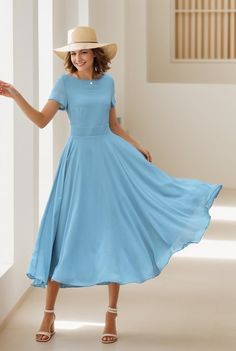 This chiffon dress is a vision of grace and elegance, presented in a serene sky blue that evokes the tranquility of a clear day.  The lightweight chiffon material adds an airy and ethereal quality to the dress, making it an ideal choice for occasions that call for a blend of comfort and refined style. DETAILS * Made of Chiffon fabric, fully chiffon liner * Midi dress * Without pockets * Fitted waist to show off your curves * Concealed Back zip closure  * Perfect for summer * Wash by hand or mach Flowy A-line Chiffon Dress, Flowy Knee-length Chiffon Wedding Dress, Fitted Chiffon A-line Dress, A-line Chiffon Dress With Flowy Skirt, Solid Color Chiffon Empire Waist Dress, Flowy Chiffon Short Sleeve Dress For Evening, Flowy Chiffon Dresses With Empire Waist, Blue A-line Chiffon Dress For Wedding, Flowy A-line Chiffon Bridesmaid Dress