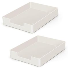 two white trays sitting side by side on top of each other