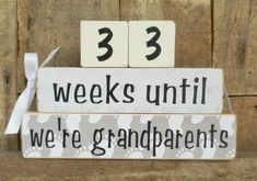 two blocks with numbers on them that say, 33 weeks until we're grandparents