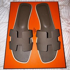 These Have Been Worn Once. But They’re Not Comfortable For Me. Like New - Only A Few Small Signs Of Wear On The Bottom Of The Sole. Hermes Oran Etoupe, Hermes Shoes, Hermes Oran, Small Signs, Women's Shoes Sandals, Shoes Sandals, Dust Bag, Like New, Size 7