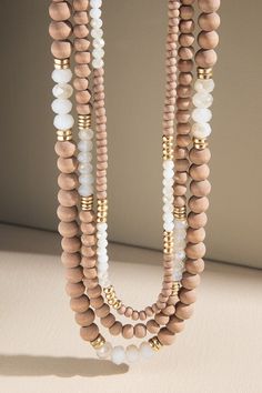 Stunning glass and wood beaded triple strand statement necklace with lobster clasp closure in a trendy mocha and white color. *Wood, Glass Beads, Metal *Nickel/Lead Compliant *APPROX. L 15.5" Ext. 3" + L 16.25" Ext. 3" + L 17" Ext. 3" Mixed Beads Necklace, Wood Necklace, Gift Boutique, Multi Strand Necklace, Wood Glass, Strand Necklace, Ladies Boutique, Multi Strand, Wood Beads