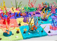 many different colored sea creatures are on the table