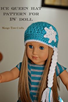 a doll wearing a blue and white knitted hat