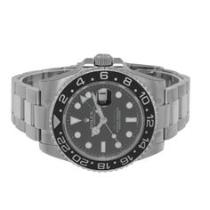 Description Guaranteed Authentic Men's Rolex GMT-Master II with a 40mm stainless steel case and a bidirectional rotatable Cerachrom bezel insert with 24-hour engraved markings. This fine timepiece features a green 24-hour second-time zone hand, independent 12-hour hand, black dial, and stainless steel Oyster bracelet. This watch is brand new, old stock (NOS) 2008 production with all factory stickers, Bar Code. The first Rolex sports model ever made with a ceramic bezel. It comes with a One Year Warranty from Da Vinci Fine Jewelry, Inc., a Rolex box and Rolex Papers (2008) certified retail appraisal from Da Vinci Fine Jewelry, Inc. Details BRAND Rolex COLLECTIONS GMT Master II Model 116710LN MOVEMENT Automatic SIZE 40mm CASE MATERIAL Stainless Steel BEZEL Black Ceramic 24 Hour DIAL COLOR Bl Black Stainless Steel Watch With Date Indicator, Luxury Black Chronograph Watch With Date Display, Black Stainless Steel Watch With Date Display, Luxury Watch With Stainless Steel Clasp And Round Dial, Black Stainless Steel Watches With Date Display, Luxury Watch With Stainless Steel Clasp, Luxury Black Watches With Date Display, Luxury Silver Chronograph Watch With Stainless Steel Clasp, Luxury Black Chronograph Watch With Date Indicator