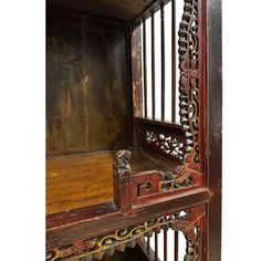 an old wooden shelf with ornate carvings on it