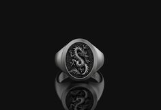 Title: Chinese Serpent Dragon Signet Ring Mythical Creature Jewelry Gift Him 925 Sterling Silver Oxidized Birthday Gift for Him Mens Accessory Gift It is ideal for daily use with an oxidized finish on 925 sterling silver, which makes details more attractive eye-catching. Other finishes available, all you need to do is note us after you made the purchase 🤗- All of our products are handmade and their materials are 925 sterling silver.- Ring Weight: 14-15 Grams- Feel free to contact us!- Processin Black Sterling Silver Jewelry With Engraving Option, Black Sterling Silver Signet Ring With Engraving Option, Elegant Gift Signet Ring With Oxidized Finish, Silver Oxidized Finish Signet Ring As Gift, Luxury Jewelry With Dragon Design, Luxury Dragon Design Jewelry, Luxury Men's Jewelry With Dragon Design, Dragon Design Ring Jewelry For Gift, Serpent Dragon