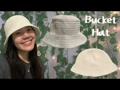 a woman wearing a white crocheted bucket hat next to a wall with ivy