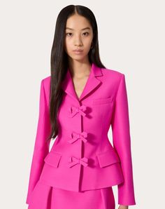 Crepe Couture jacket - Front fastening with press-stud buttons - Bow detail - Crepe Couture (65% Virgin Wool, 35% Silk) - Gino Saglia lining (100% Cupro) - Length: 60 cm / 23.6 in. from the shoulders in an Italian size 40 - Sleeve length: 83 cm / 32.7 in. from the centre back in an Italian size 40 - The model is 176 cm / 5'9" tall and wears an Italian size 40 - Made in Italy The look of the model is completed by a Valentino Garavani Bag and Valentino Garavani Shoes. Designer Structured Blazer For Spring, Spring Office Outerwear With Structured Boning, Designer Spring Blazer With Buttons, Designer Blazer With Covered Buttons, Designer Spring Blazer With Button Closure, Spring Blazer With Notch Lapel And Covered Buttons, Spring Blazer With Covered Buttons And Lapel Collar, Designer Tailored Outerwear With Covered Buttons, Designer Fitted Pink Outerwear