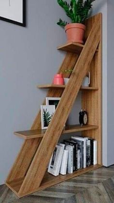 a wooden shelf with books and plants on it