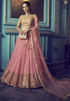 Net Lehenga in Pink This Attire with Poly Shantoon Lining is Enhanced with Zari, Sequins and Patch Border Work Available with an Unstitched Net Choli in Beige and a Net Scalloped Dupatta in Pink. Choli Length is 14 to 15 inches This Semi-stitched Lehenga Waist and Hips are Customizable from 32 to 36 and 40 to 44 inches respective;y. Its Length is 42 inches Do note: Accessories shown in the image are for presentation purpose only.(Slight variation in actual color vs. image is possible). Indo Western Lehenga, Pink Bridal Lehenga, Party Wear Lehenga Choli, Net Blouses, Bollywood Lehenga, Lehenga Online, Net Lehenga, Lehenga Choli Online, Pink Lehenga