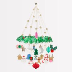 a mobile with christmas decorations hanging from it's sides and stars on the top