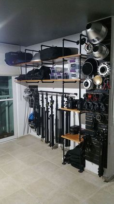 a room with shelves filled with lots of items and equipment on it's sides