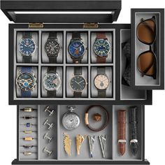 an open watch box with many different watches in it's display case and sunglasses