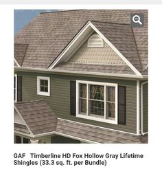 an image of a gray house with white trim and brown shingles on the roof