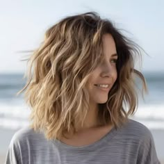 Relaxed Beach Waves with Choppy Layers Medium Length Wavy Hair With Layers Beachy Waves, Layered Lobs For Thick Hair, Layered Choppy Hair Medium, Medium Length Hair Beach Waves, Layers For Thick Wavy Hair, Medium Length Wavy Haircut With Layers, Beach Wave Haircut, Beach Waves Medium Length Hair, Shoulder Length Hair Cuts With Layers Choppy