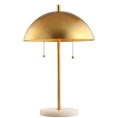 a gold colored lamp on a white background