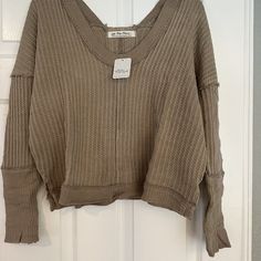 Nwt Free People New Magic Thermal In Golden Olive. This Is A Size Small. Awesome Neckline On Both Front And Back. Oversized Loose Fit. Shorter Length. Trendy Oversized Neutral Tops, Neutral Long Sleeve Top For Loungewear, Neutral V-neck Blouse For Fall, Casual Neutral V-neck Blouse, Casual V-neck Neutral Blouse, Oversized Neutral Casual Blouse, Neutral Long Sleeve Cotton Top, Neutral V-neck Tops For Fall, Neutral Long Sleeve Top Relaxed Fit