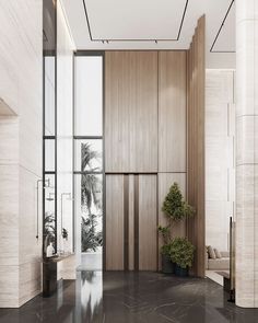 an empty room with wood paneling and black marble floors, along with a potted plant in the corner