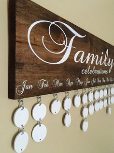 a wooden sign hanging from the side of a wall next to earring hooks and earrings