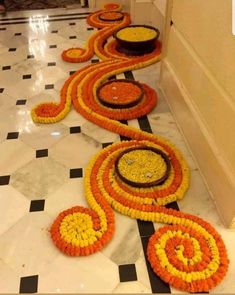 a long line of flower decorations on the floor