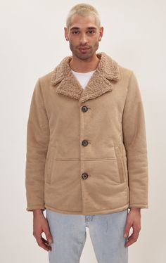 Our vegan shearling button closure jacket is an ethical and stylish choice for keeping warm and comfortable during the cooler seasons.Unlike traditional shearling, which is made from sheepskin, vegan shearling is crafted from synthetic materials that mimic the look and feel of real shearling. This makes it an animal-friendly option without compromising on softness or warmth. Made from super soft vegan leather and inner shearling. Cut close for a TAPERED, streamlined fit, this jacket provides a lightweight supple feel for year round wear. With a zipper closure that runs the length of the jacket, this edgy design pairs well with just about any outfit for an added statement. SIZE + FIT Tailored fit, to find your correct size use the ''what's my size '' button. COMPOSITION 100% PolyesterMade i Edgy Design, Jackets Men Fashion, Synthetic Materials, My Size, Jacket Style, Keep Warm, Vegan Leather, Stone, How To Wear