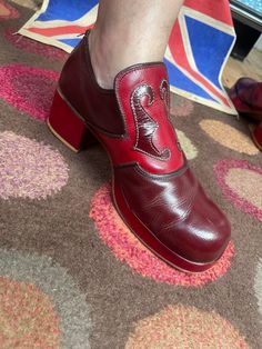 Absolutely outstanding and amazing original platform shoes here. Comes in at a UK 9,USA 10,euro 43 These are Glam rock at it's best. Heel measures 5.8cm and the sole is 2.2cm. A really amazing colour of which is hard to find now,maroon/wine colour and red,condition is very good even though the backs of both shoes around the heel area shows wear,probably where the shoes have been forced on,shoes in this colour generally can look really bad because the knocks stand out,these look amazing and the heels are near enough un touched,the generally get the heel knocks,the elastic that is under each tongue has come away but as shown this makes no difference to how the shoe is worn as in pic 1. Unknown maker but styled by Eugenio,Spanish possibly. Some beautiful platforms out there and these are up t Retro Round Toe Platform Heels, Retro Platform Heels With Round Toe, Retro Chunky Platform Heels With Closed Toe, Red Retro Block Heel Shoes, Retro Red Block Heel Shoes, Retro Heels With Red Sole And Round Toe, Retro Pointed Toe Platform Boots, Vintage Red Round Toe Heels, Vintage Heels With Red Sole And Round Toe