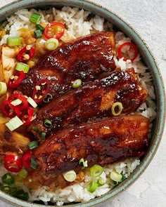 a bowl filled with rice, meat and veggies