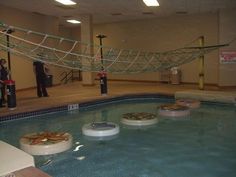 an indoor swimming pool with some food in it