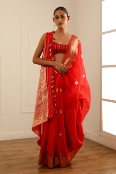 Red banarasi kora organza saree with gold toned flowery borders and floral chand buta detailing. Comes with an unstitched blouse piece. - Aza Fashions Red Chanderi Pre-draped Saree With Zari Work, Red Pre-draped Saree With Sheer Dupatta For Puja, Festive Cotton Silk Pre-draped Saree For Celebration, Festive Red Chanderi Pre-draped Saree, Red Chanderi Pre-draped Saree With Zari Weaving, Tussar Silk Saree With Gota Work For Celebrations, Celebration Tussar Silk Saree With Gota Work, Red Pre-draped Saree With Cutdana For Celebrations, Red Cotton Silk Dupatta With Gota Work