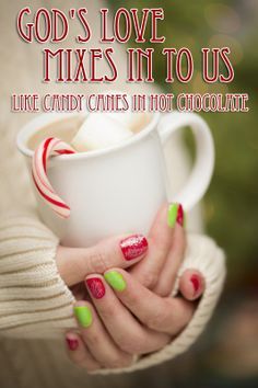 a woman holding a cup with candy canes in it and the words god's love mixes in to us like candy canes in hot chocolate