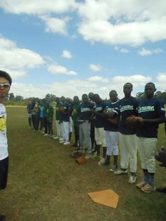 a group of young men standing next to each other on a field