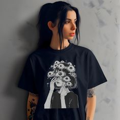 This Eyeball Goth Girl T-shirt is a must-have for anyone into Gothic clothing and weirdcore fashion. Embrace your alternative grunge style with this edgy women's shirt, perfect for creating an urban outfit. This Alt casual streetwear piece makes a great summer gift idea for the fashion-forward individual in your life. Stand out from the crowd and express your unique style with this eye-catching tee. ------- DETAILS 👕 Made from very soft materials, this tee is 100% cotton for solid colors. Heath Edgy Anime Print T-shirt For Alternative Fashion, Harajuku Style Cotton T-shirt For Alternative Fashion, Harajuku Style Graphic Print Top For Alternative Fashion, Edgy Anime Print Crew Neck Tops, Edgy Anime Print Short Sleeve Tops, Edgy Short-sleeve T-shirt With Anime Print, Edgy Tops With Anime Print For Alternative Fashion, Funny Print Cotton Top In Alternative Style, Alternative Cotton Tops With Funny Print