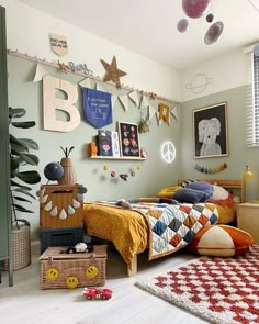 a child's bedroom with toys and decorations on the wall, including a bed