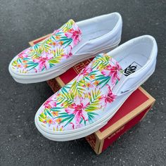 Check out our bright and vivid pink tropical hibiscus and plumaria design on White Slip On Vans. This pattern of plumaria rainbow pink flowers and bright Hawaiian hibiscus flowers with tropical palm leaves are bright and colorful on the tops of these slip on vans shoes. We buy each pair of shoes BRAND NEW. Each pair is made to order, please make sure you put in the correct shoe size before you check out. The ink is permanent and will never come off, fade away, or peel off. Made in the USA. This Sketchers Go Walk, White Slip On Vans, Pretty Sneakers, White Slip On Shoes, Slip On Vans, Tenis Vans, Hawaiian Hibiscus, Tropical Palm Leaves, Tropical Hibiscus